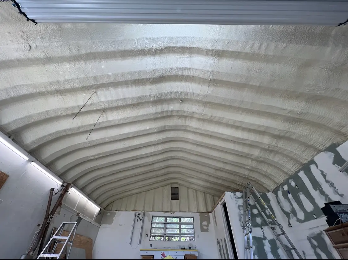 Spray polyurethane foam applied to the underside of a metal roof deck in Beverly